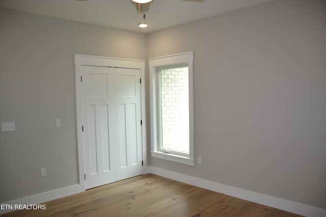 spare room featuring ceiling fan and light hardwood / wood-style floors