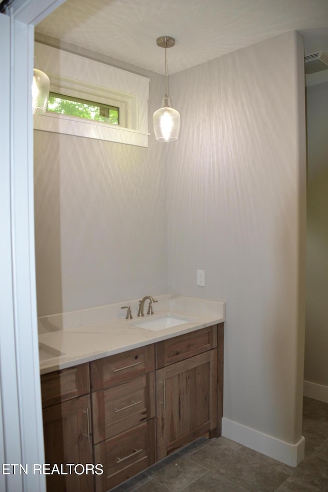 bathroom featuring tile patterned floors and vanity