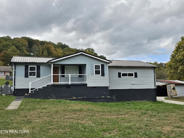 648 Poplar Ave, Jellico, TN 37762 - view of front of property featuring a front lawn and central AC unit