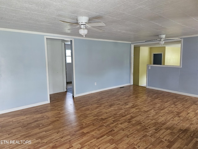 unfurnished room with ceiling fan and wood-type flooring