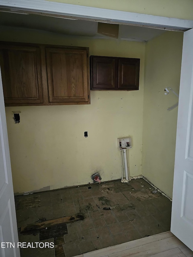 washroom featuring washer hookup and cabinets