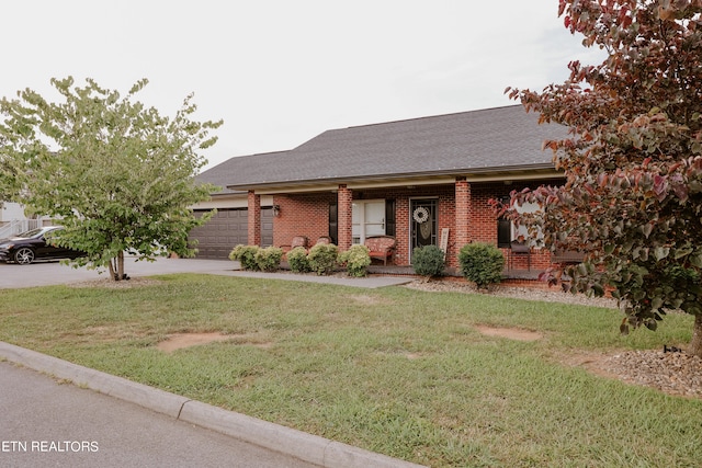 view of front of house featuring a garage and a front yard