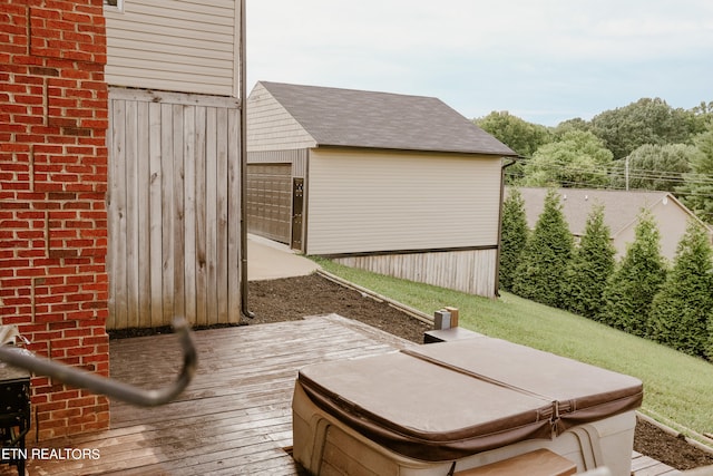 wooden terrace with a hot tub