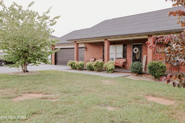 ranch-style home featuring a front yard and a garage