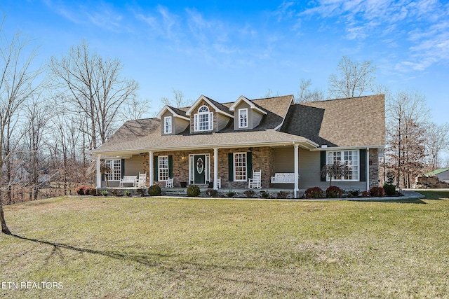 new england style home with a front yard and a porch