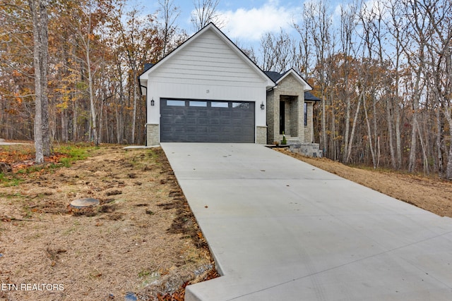 modern inspired farmhouse with a garage