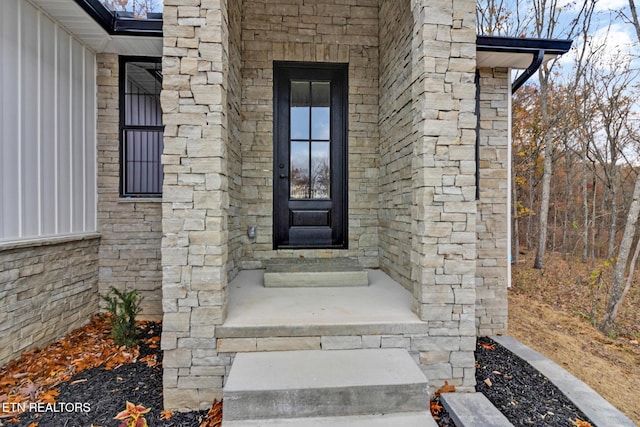 13 Norwich Ter, Fairfield Glade, TN 38558 - doorway to property with stone siding and board and batten siding