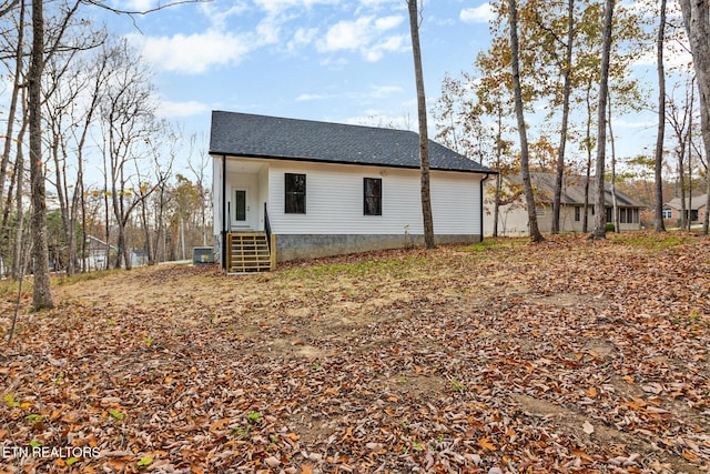 13 Norwich Ter, Fairfield Glade, TN 38558 - view of property exterior featuring roof with shingles and a cooling unit