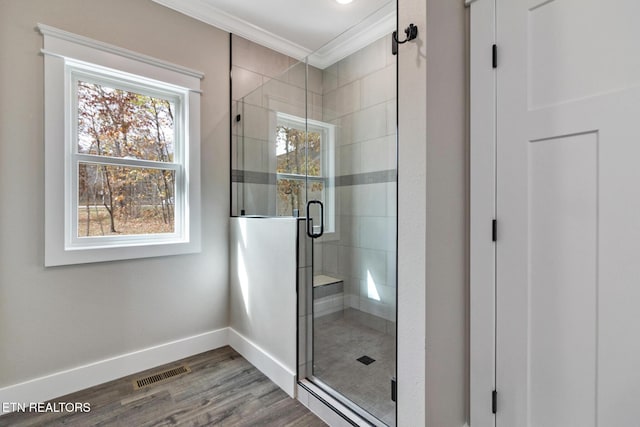 13 Norwich Ter, Fairfield Glade, TN 38558 - bathroom with ornamental molding, a stall shower, and wood finished floors