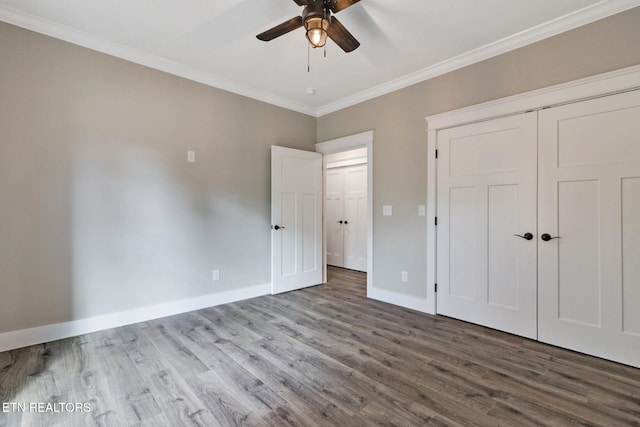 unfurnished bedroom with hardwood / wood-style floors, ceiling fan, and ornamental molding