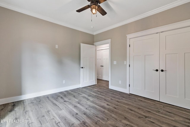 13 Norwich Ter, Fairfield Glade, TN 38558 - unfurnished bedroom featuring wood finished floors, ornamental molding, a closet, and a ceiling fan