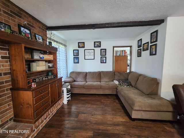 living room featuring dark wood-type flooring, a textured ceiling, and beam ceiling