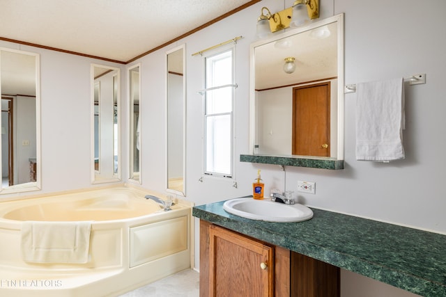 bathroom with a bath, vanity, and ornamental molding