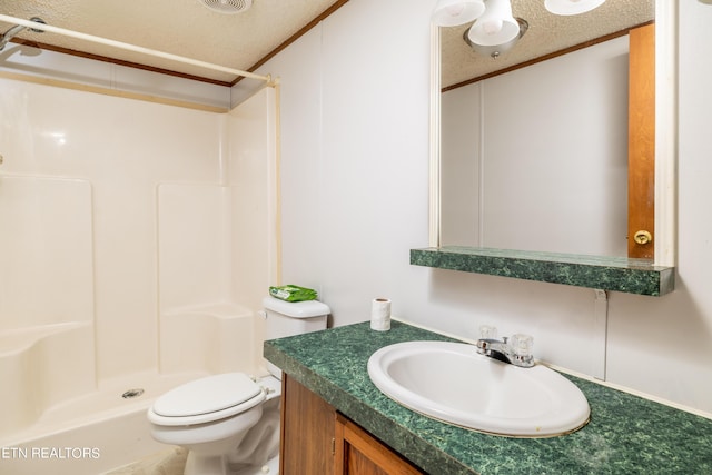 bathroom with a shower, a textured ceiling, vanity, and toilet