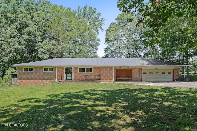 ranch-style house with a front lawn and a garage