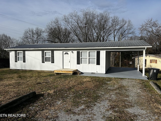 view of front of home featuring a carport