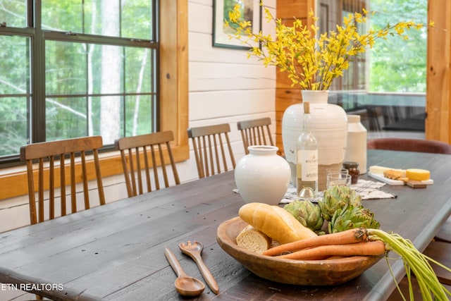 dining area with wood walls