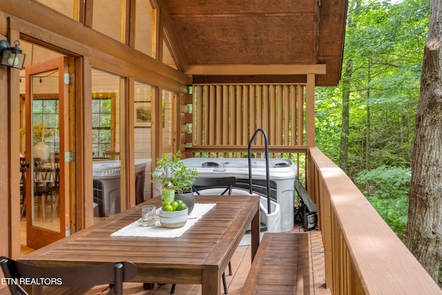 deck featuring a hot tub