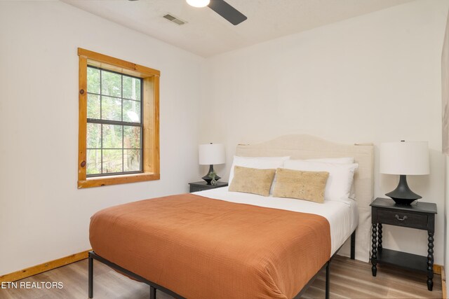 bedroom featuring ceiling fan and hardwood / wood-style floors