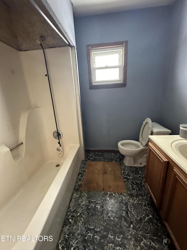 bathroom featuring  shower combination, vanity, and toilet