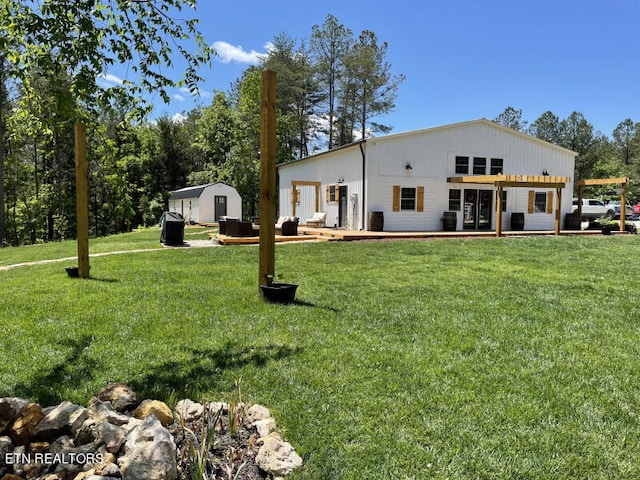 rear view of property featuring a yard