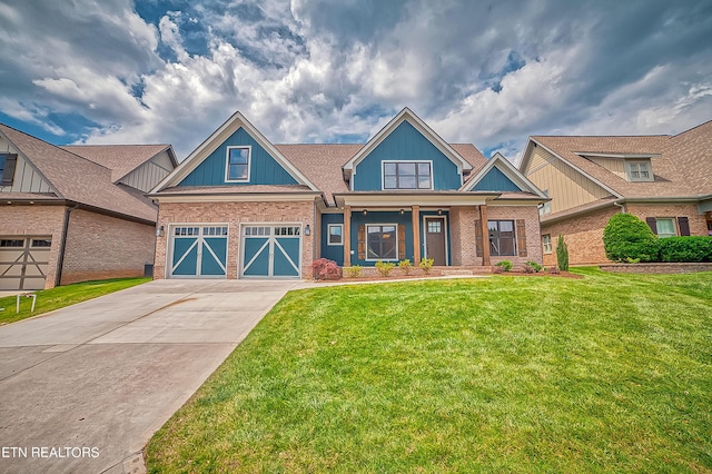 craftsman house featuring a garage and a front lawn