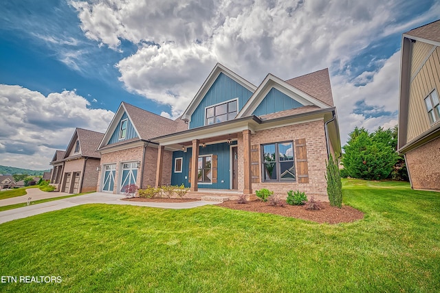 craftsman house with a garage and a front lawn