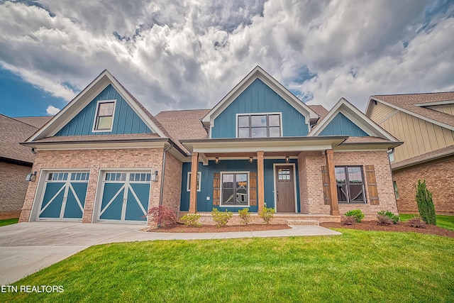 craftsman-style house with a garage and a front lawn