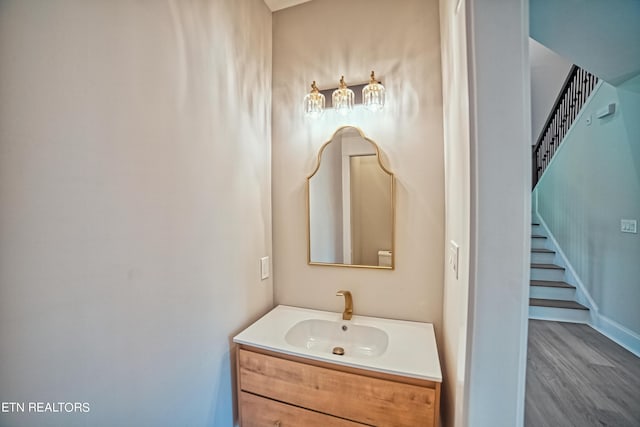 bathroom with wood-type flooring and vanity