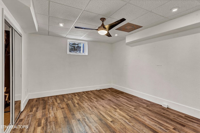 interior space with hardwood / wood-style floors and a paneled ceiling