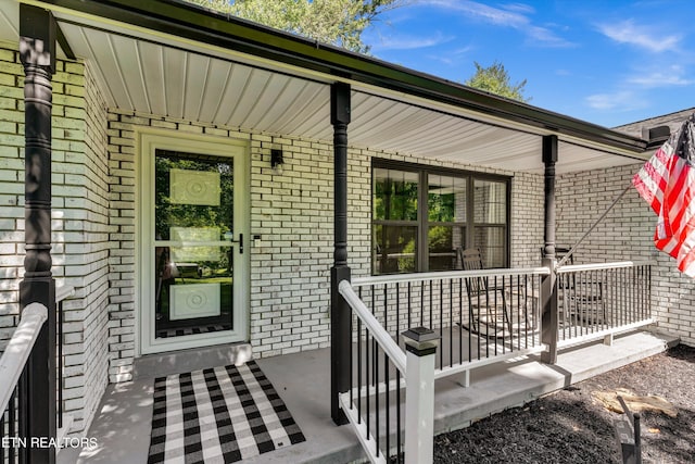 entrance to property with a porch