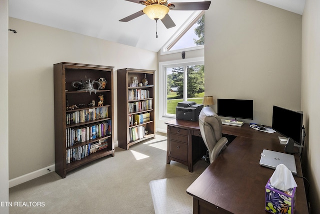 office area with baseboards, light colored carpet, high vaulted ceiling, and ceiling fan