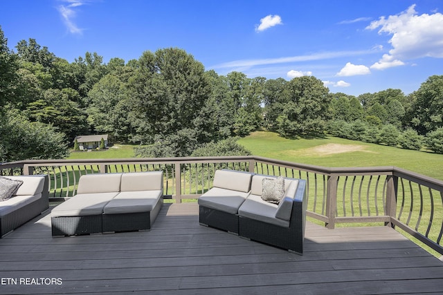 deck featuring outdoor lounge area and a lawn