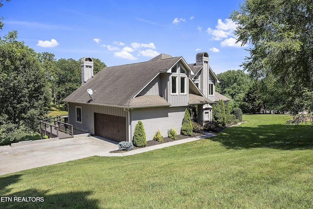 view of side of home featuring a lawn, driveway, a shingled roof, a garage, and a chimney