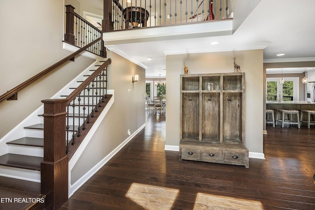 interior space with recessed lighting, baseboards, hardwood / wood-style floors, and ornamental molding