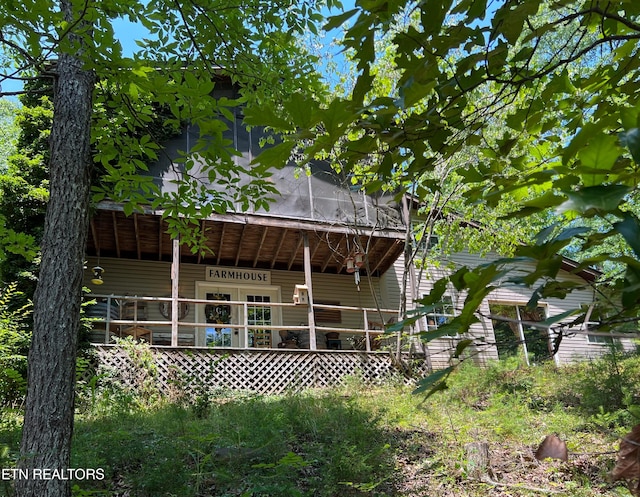 back of house featuring a deck