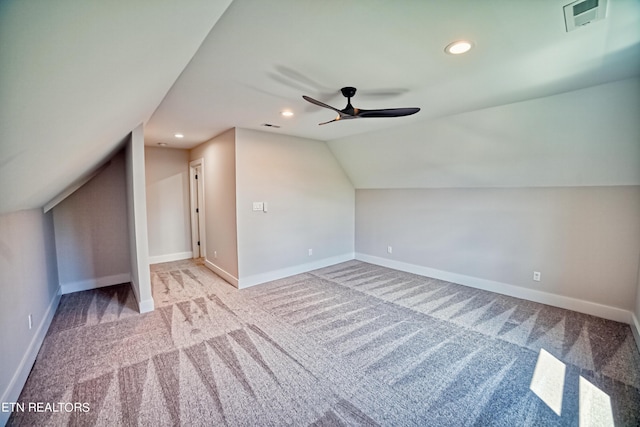 additional living space featuring baseboards, visible vents, lofted ceiling, ceiling fan, and recessed lighting