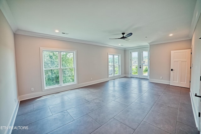 unfurnished room with french doors, visible vents, crown molding, and baseboards