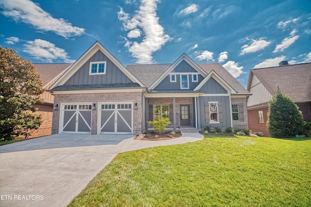 craftsman-style home with driveway, a front lawn, board and batten siding, and brick siding