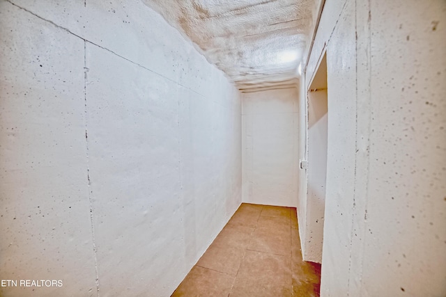 hallway with light tile patterned flooring