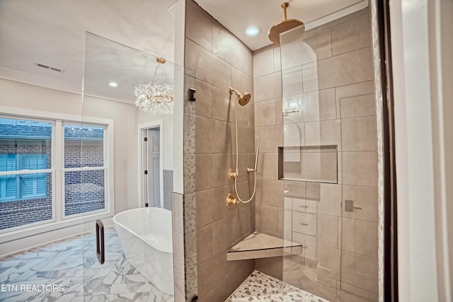 full bathroom with marble finish floor, a freestanding tub, a tile shower, and visible vents