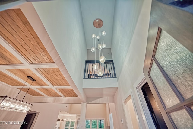 interior details with wood ceiling and a notable chandelier