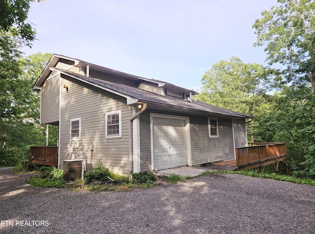 view of property exterior featuring a deck and cooling unit