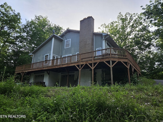 rear view of property with a deck