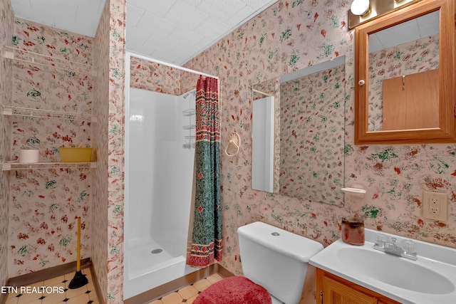 bathroom with toilet, vanity, a shower with shower curtain, and tile patterned flooring