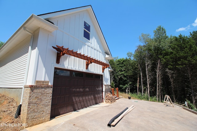 view of side of property with a garage