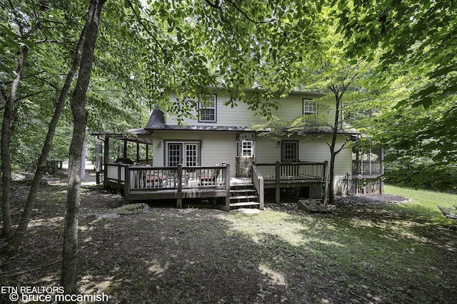 back of property featuring a deck