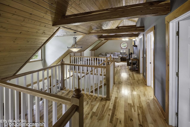 corridor featuring wooden ceiling, light hardwood / wood-style floors, and vaulted ceiling with beams