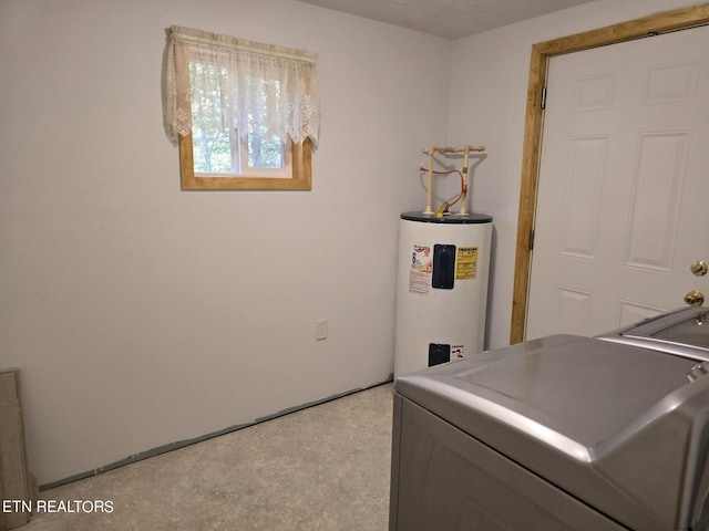 clothes washing area with washer / dryer and water heater