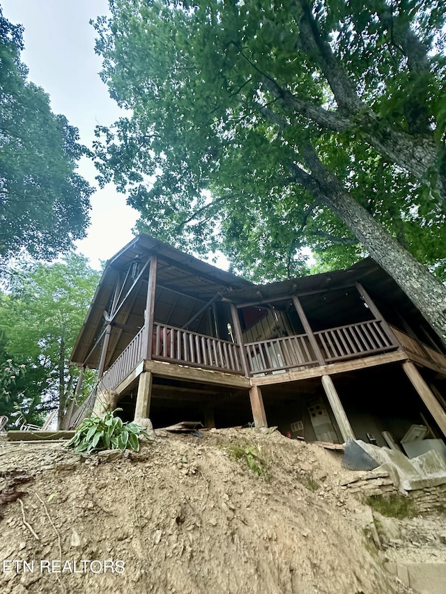 view of side of property with a wooden deck